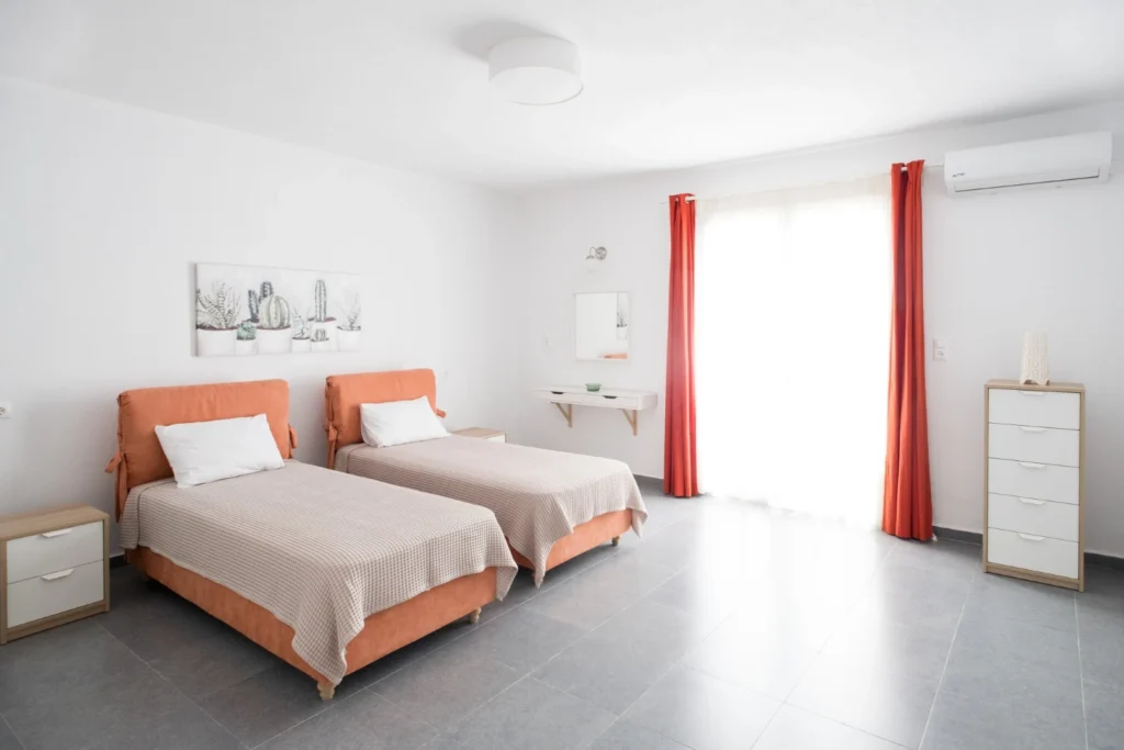 Guest bedroom with twin beds at Aegean Breeze Villa