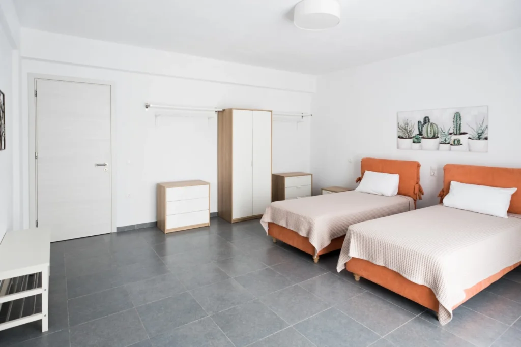 Cozy bedroom designed for comfort and privacy in Aegean breeze villa