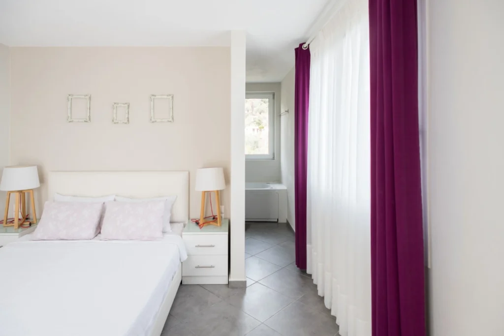 Master bedroom with double bed at Aegean Breeze Villa