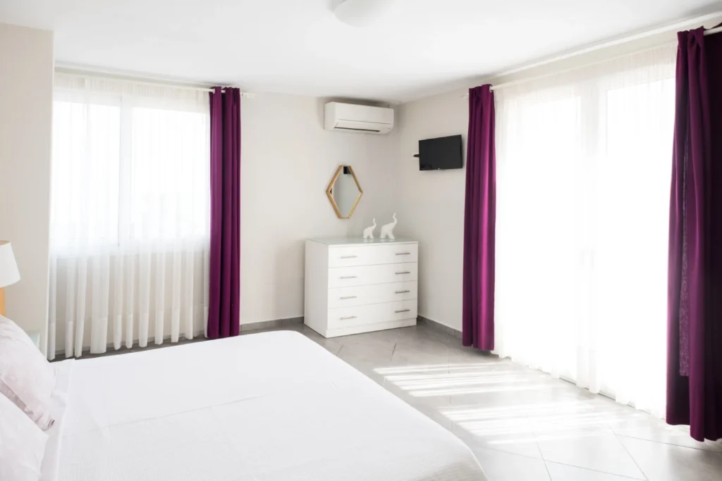 Bright bedroom with elegant decor in private villa in Skiathos