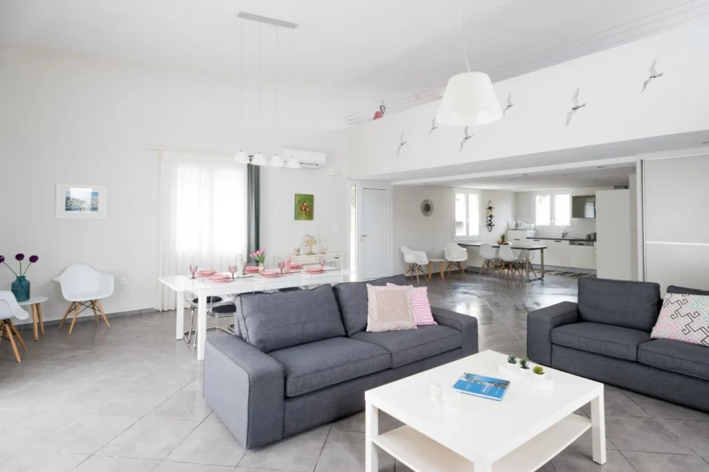 Spacious living area with natural light at Aegean Breeze Villa