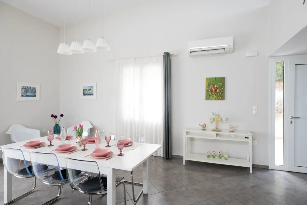 Comfortable living room with outdoor access in Skiathos villa