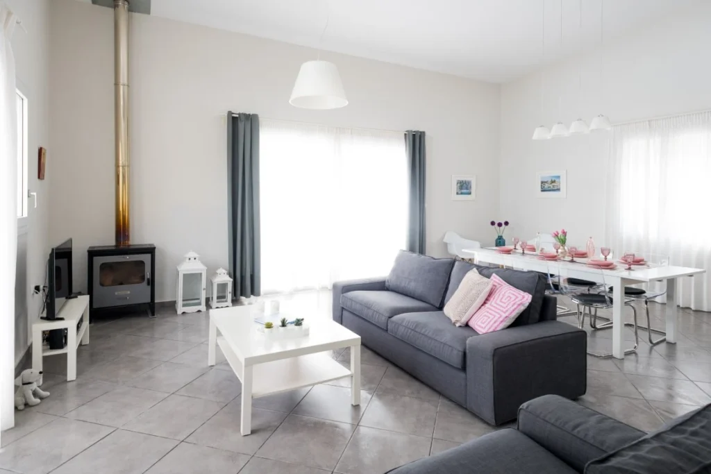 Comfortable living room with outdoor access in Skiathos villa