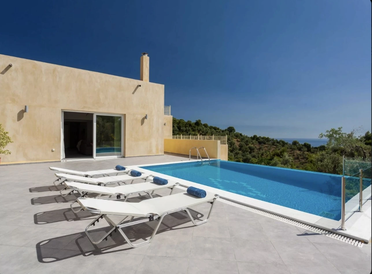 Aegean breeze Skiathos villa outdoor pool view with sunbeds