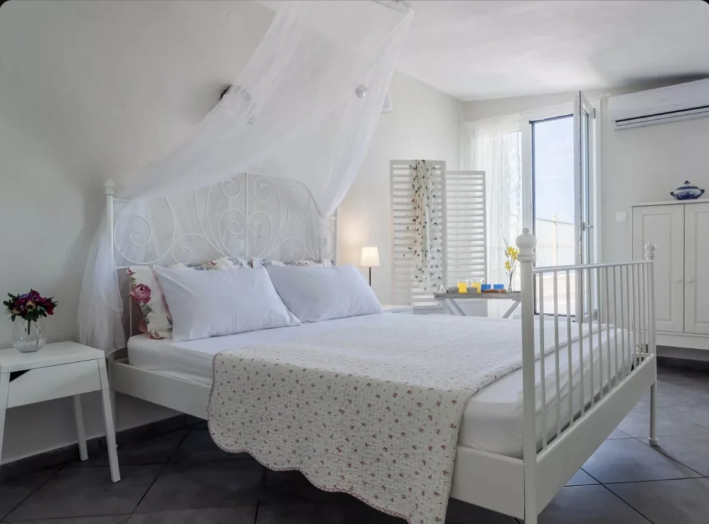 Light-filled bedroom in private sea view villa
