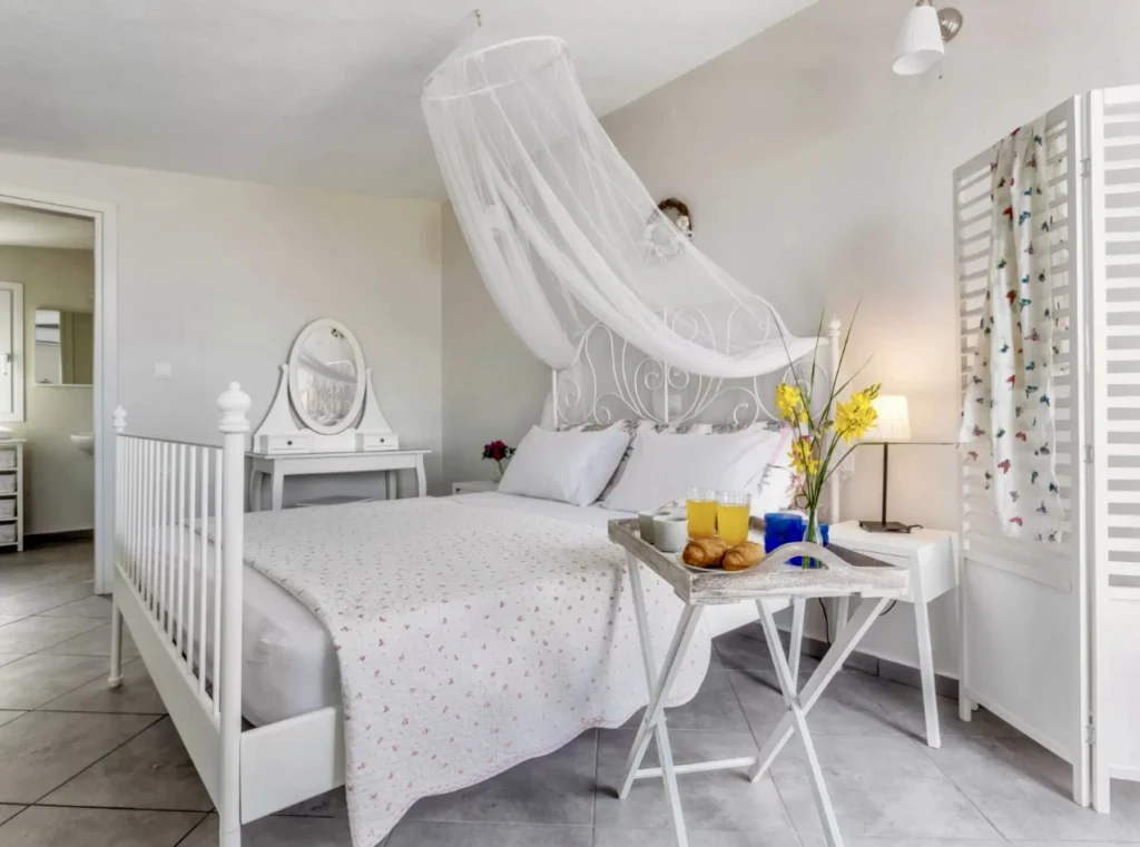 Bedroom with double bed and minimal design at Aegean Breeze Villa